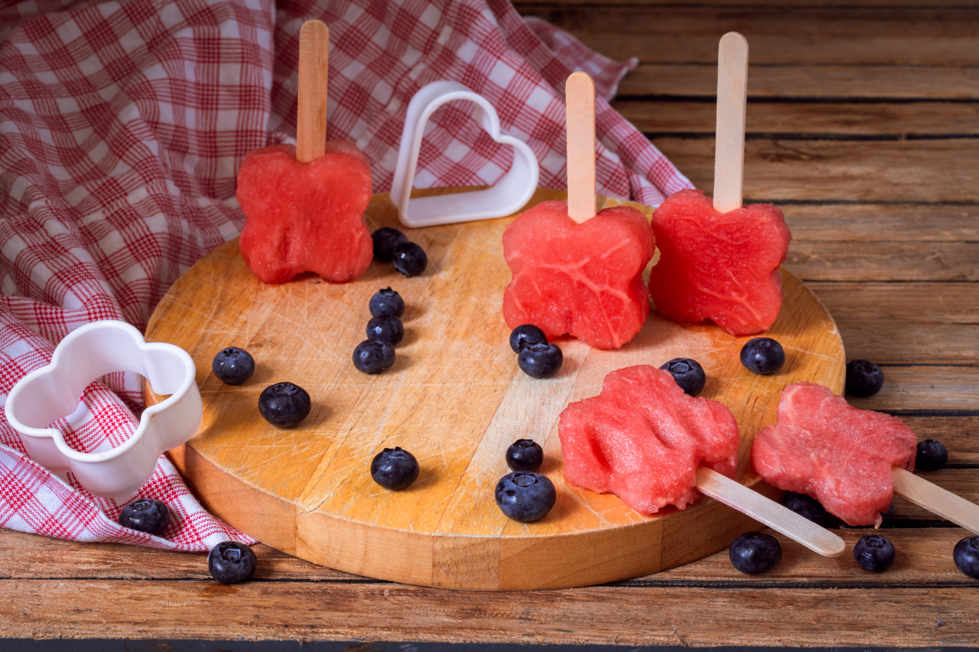 Watermelon popsicles with blueberries displayed 