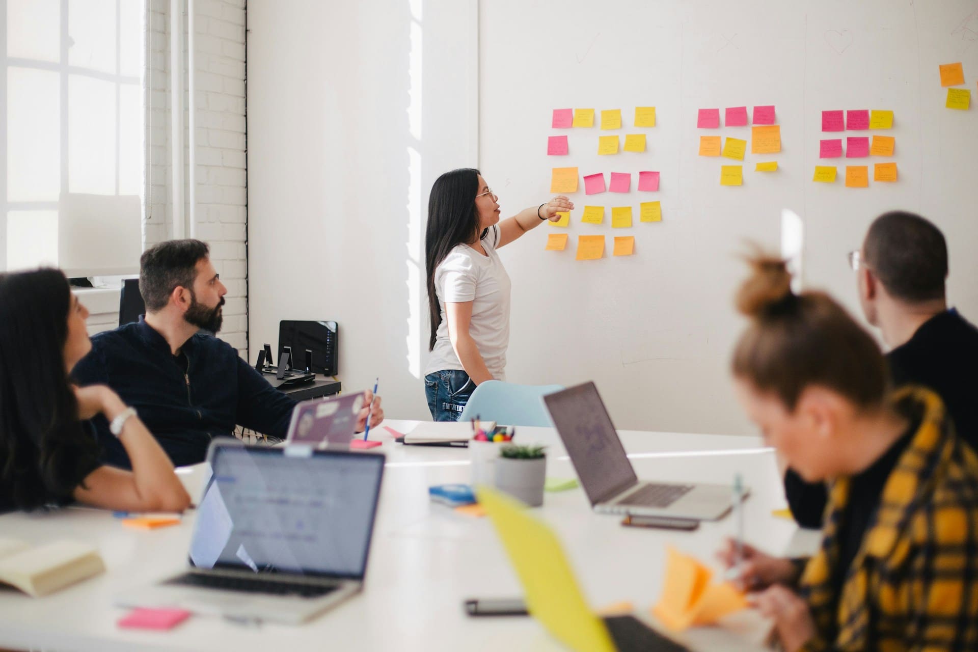 A woman presenting ideas during a team meeting