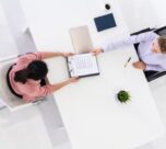 Two Women in an Office for Job Application and Hiring Agreement